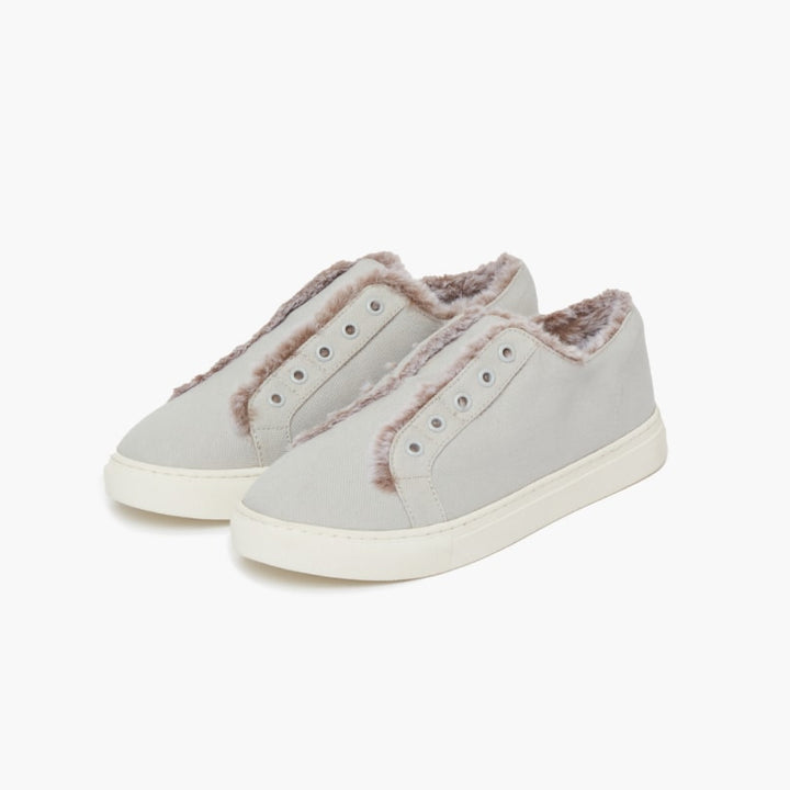 Grey faux fur lined slippers set against a white backdrop #color_grey