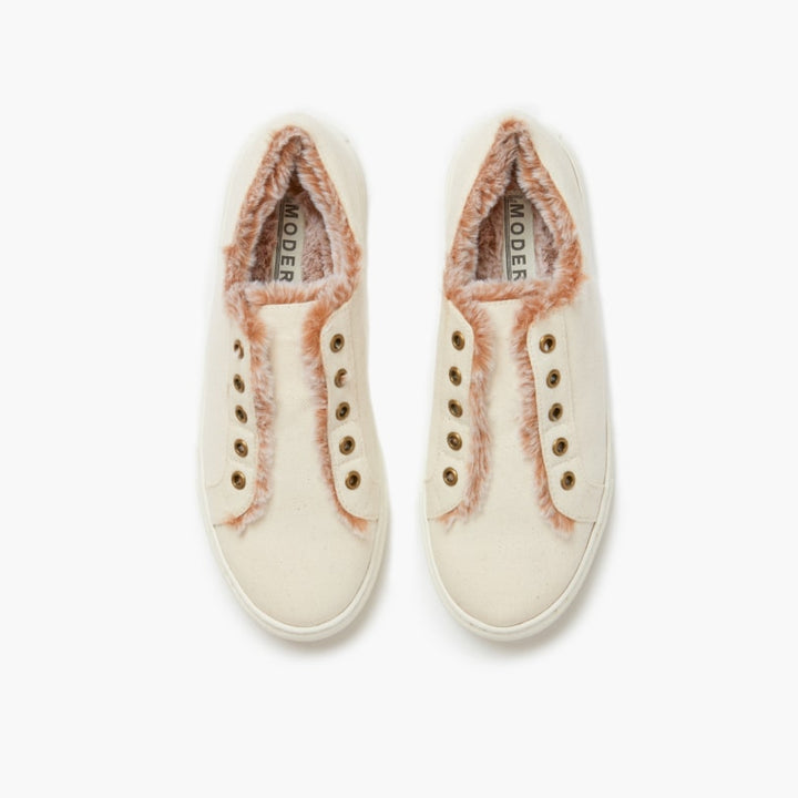 Aerial view of off white faux fur lined slippers set against a white backdrop #color_off-white