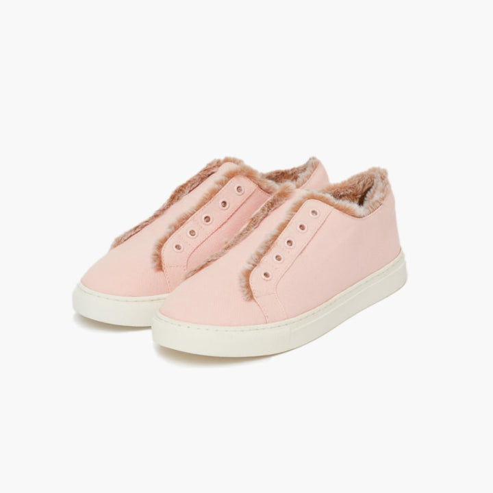 Pink faux fur lined slippers set against a white backdrop #color_pink