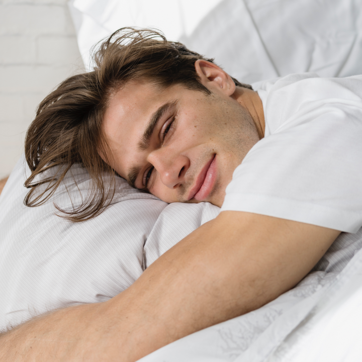 Man sleeping with Light Grey Twill sheets.